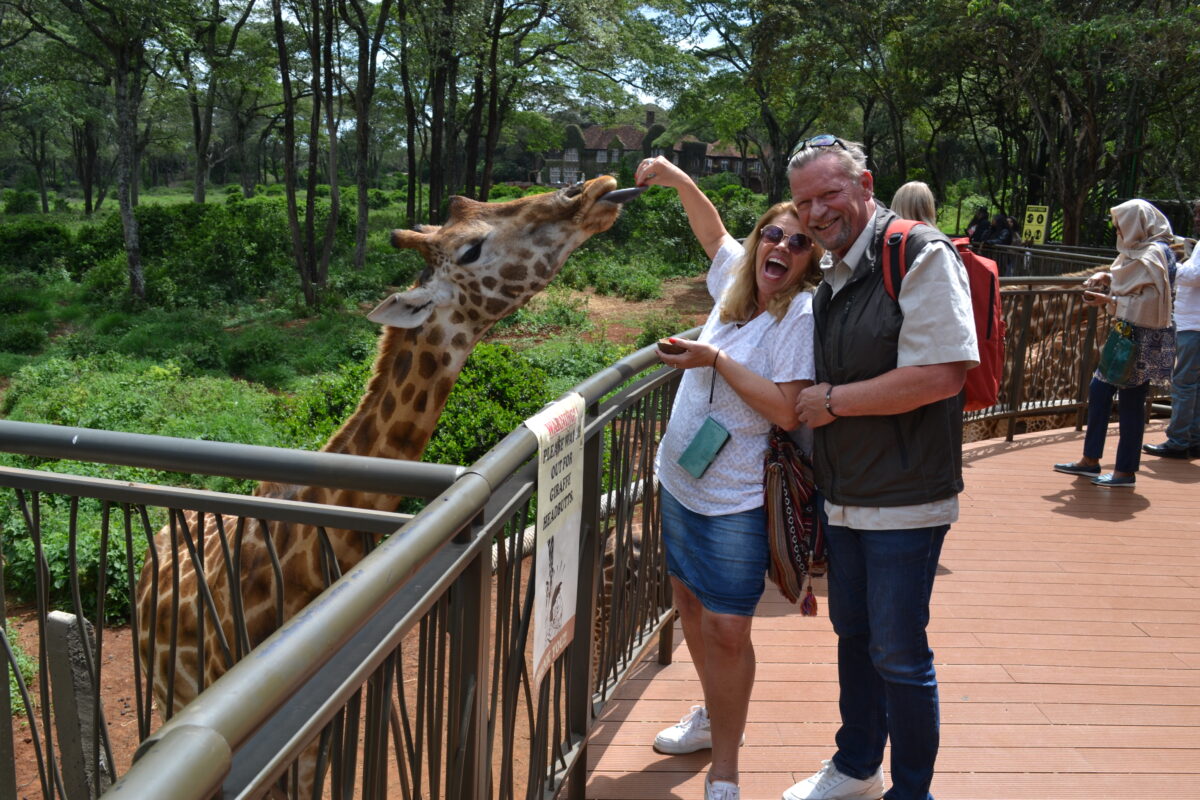 Tourists at the Giraffe Manor in Nairobi,Kenya